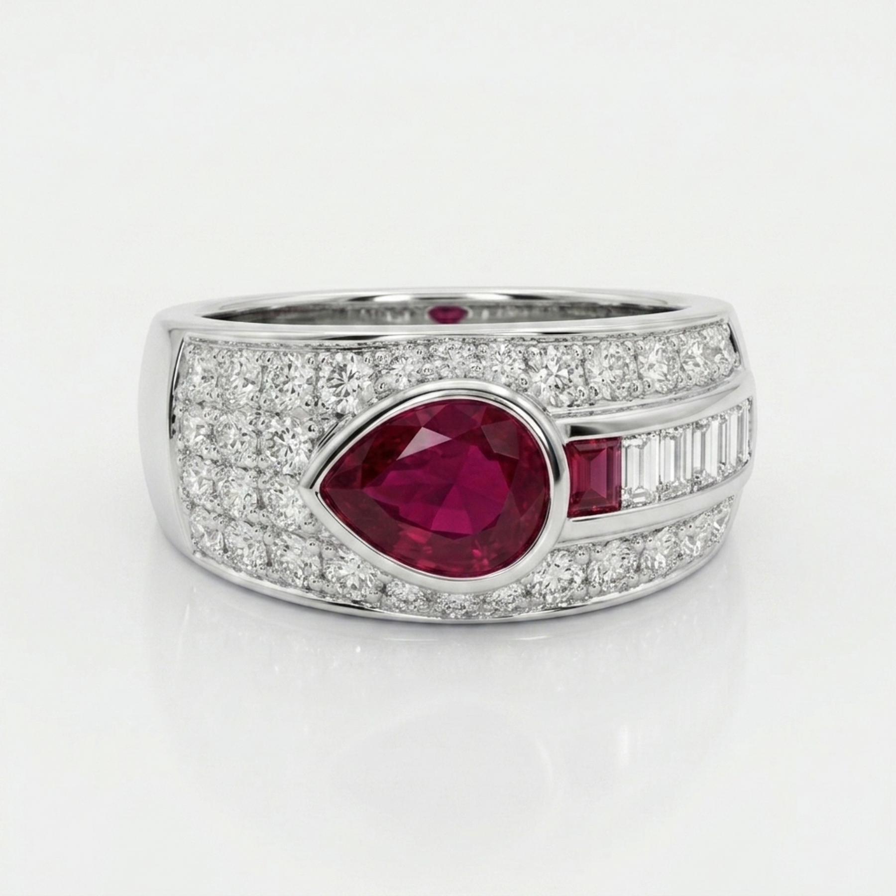 Bespoke 18ct white gold ring with a pear-cut ruby and diamonds, remodelled by Syna Jewellery using the client’s own gold and gemstones